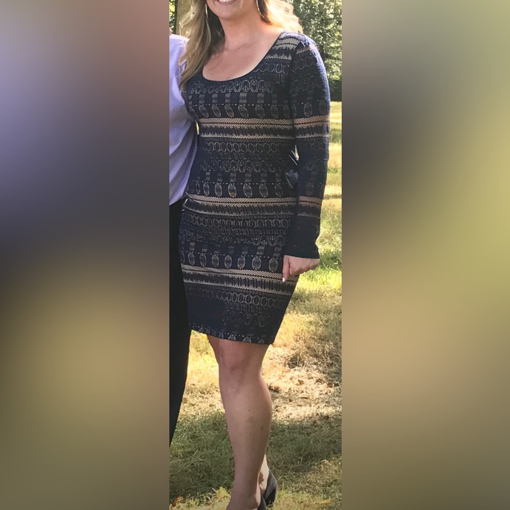 sexy pullover style is rendered in bold stretch lace. Scoopneck long sleeves.